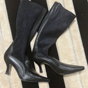 Black suede, and leather boot zips up the back